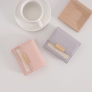 Minimalist short tri-fold wallets in pink and lilac with gold metal buckles and stitching