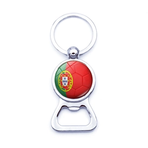Detail of metal beer bottle opener keychain with Portugal flag and soccer ball glass dome