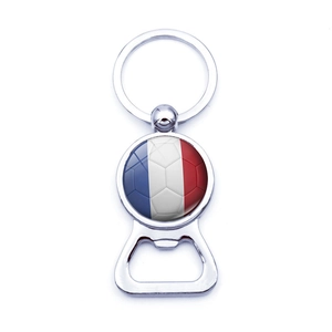 Detailed close-up of a silver metal bottle opener keychain with France flag football design