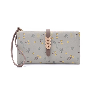 Detail of light green floral long wallet with golden leaf clasp and leather wrist strap