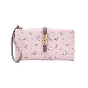 Close-up of pink floral long wallet with cherry pattern and golden wheat metal clasp