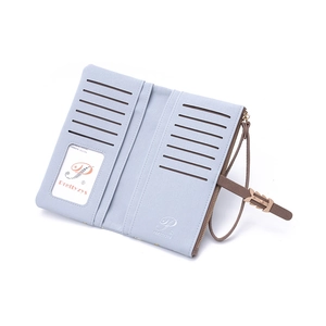 Detail view of functional interior with multiple card slots and wristlet on blue wallet