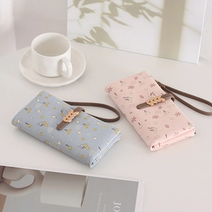 Long PU leather wallets with cherry floral prints, wrist straps and leaf metal buckles