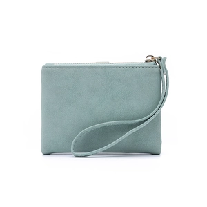 Close-up of mint blue matte short wallet with golden zipper and wrist strap detail