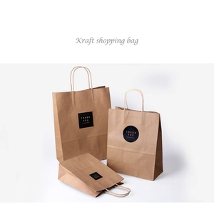 Brown kraft paper gift bags with Thank You stickers and twisted rope handles