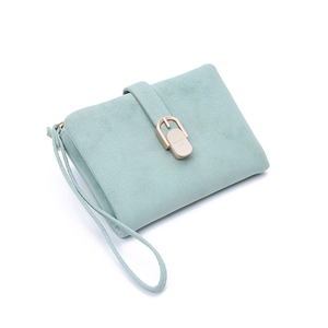 Detailed macro of mint green suede wallet with gold-tone buckle and wrist strap