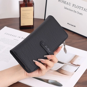 Close-up of black leather long wallet with lychee texture and multi-card slot detail