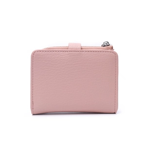Detail view of pink pebbled leather mini wallet featuring top zipper and snap button closure