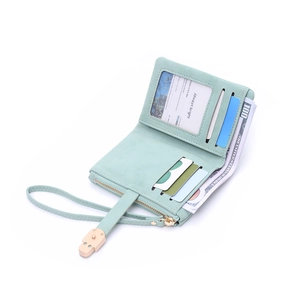 Close-up of mint green matte leather wallet with multiple card slots and wrist strap