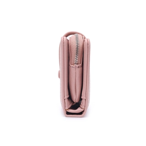 Side view showing layered thickness and hardware zipper of pink pebbled leather card holder