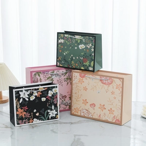 Floral vintage paper gift bags with handles for clothing and elegant packaging solutions