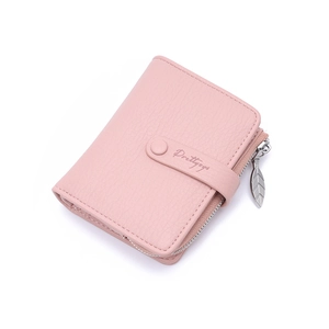 Detail of soft pink litchi grain wallet with leaf zipper pull and metal buckle