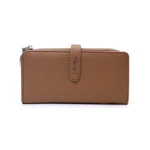 Detailed close-up of camel brown pebble leather texture and metal buckle on long wallet