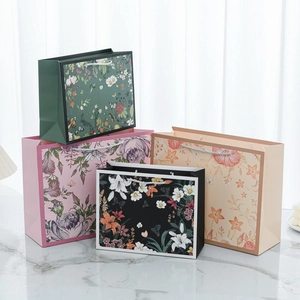 Floral print thick paper gift bags with woven handles in four elegant colors and patterns