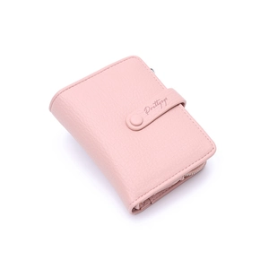 Detail view of pink lychee texture leather wallet with gold zipper and buckle closure