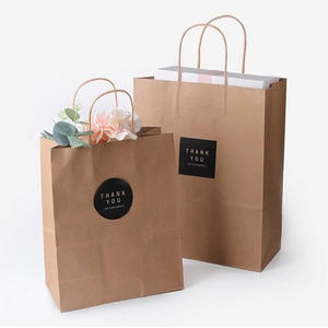 Brown kraft paper gift bags with handles and Thank You labels in two different sizes