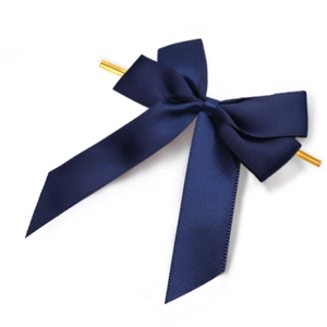 Detail of dark blue satin bow with gold twist tie for gift box and bakery packaging