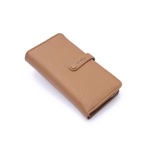 Detail view of brown lychee grain faux leather wallet with snap closure and zipper