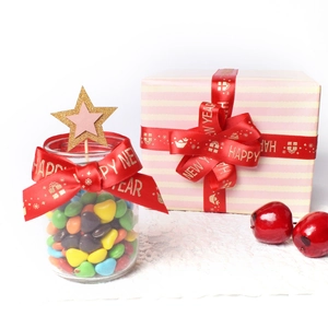 Red festive ribbon with Happy New Year gold print for gift wrapping and jar decoration