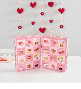 Detailed view of pink gift box set with cartoon illustrations and happy birthday text
