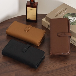 Litchi pattern leather long wallets for women in black and brown colors on wooden desk