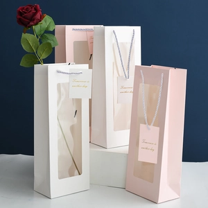 Minimalist wine gift bags in white and pink with clear window and rope handles