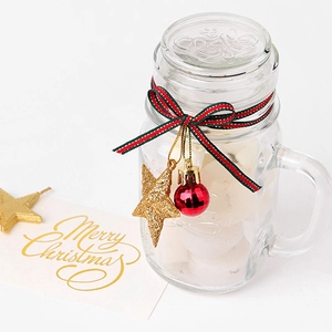 Christmas glass mason jar with festive red ribbon bow and golden star ornament gift set
