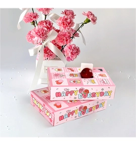 Pink 12-slot surprise blind box with 'Happy Everyday' print and floral decor