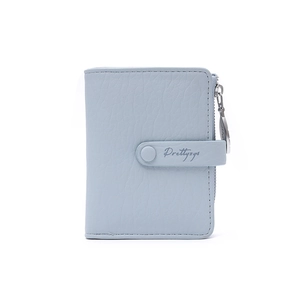 Detail of light blue litchi grain leather wallet with snap buckle and metal zipper