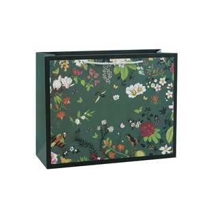 Vintage dark green gift bag with floral and bird prints and white rope handles