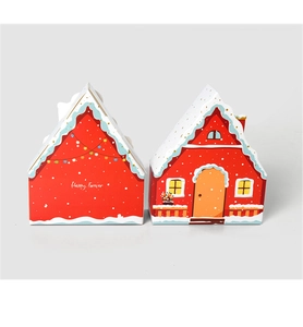 Detail of red house-shaped gift boxes featuring door illustrations and Happy Forever text