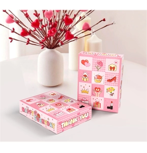 Detailed view of pink gift box with cute illustrations and Happy Everyday greeting
