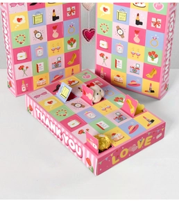 Internal view of the 24-grid pink Mother's Day surprise box showing toys and chocolates