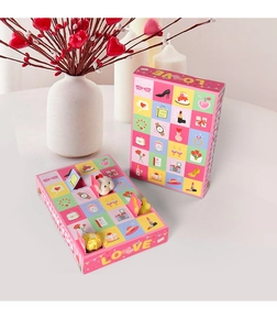Detail of pink Mother’s Day advent calendar boxes with heart illustrations and small gift slots