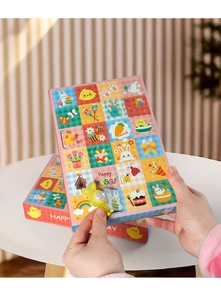 Detail of opening an Easter 24-grid calendar box with a glowing rabbit toy inside