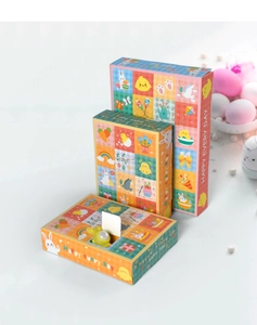 Three Easter surprise gift boxes with rabbit graphics and open view of inside toy