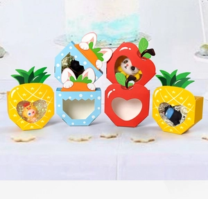 Detail of colorful fruit and rabbit shaped gift boxes with clear window design