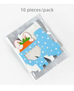 Flat lay of 10 pack bunny themed candy gift boxes with clear window and carrot motif