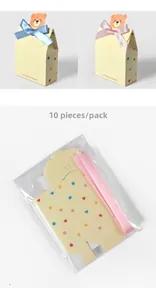 Flat lay of 10 pack unassembled cartoon bear chocolate boxes with colorful dot patterns