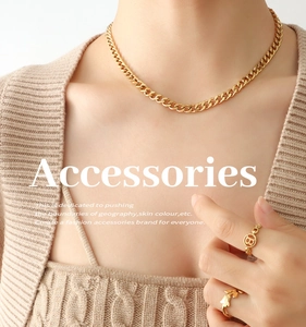 Close-up of gold-plated double-layer portrait necklace and letter B ring on model