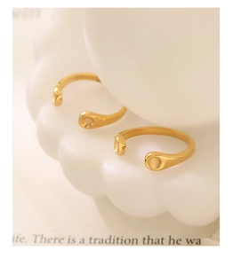 Macro shot of two 18K gold plated stainless steel open rings with minimalist design