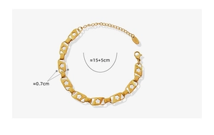 Détail du bracelet à fleurs dorées évidées avec fermoir mousqueton et extension de chaîne K18