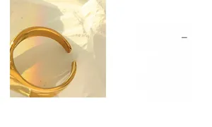 Macro view of golden vintage-style pearl ring with 18K gold plated polished details