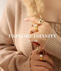 Close-up of retro 18K gold plated pearl and checkerboard enamel rings on model
