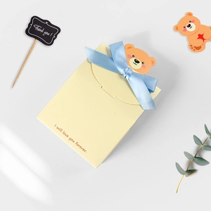 Cartoon bear gift box with blue bow and I will love you forever print on yellow cardstock
