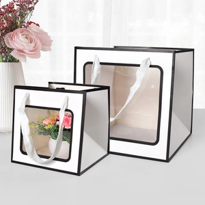 Minimalist white gift bag with transparent window and woven handles in two sizes