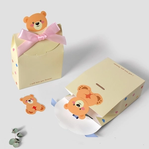 Cartoon bear gift box in light yellow with pink ribbon for baby shower parties