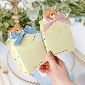 Cartoon bear gift boxes with blue and pink ribbons for baby shower and gender reveal parties