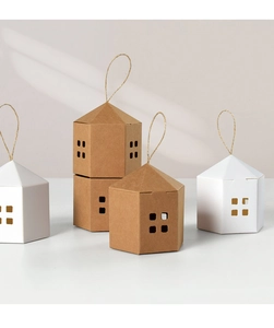 Detail of kraft paper house-shaped gift boxes with cutout windows and jute rope handles