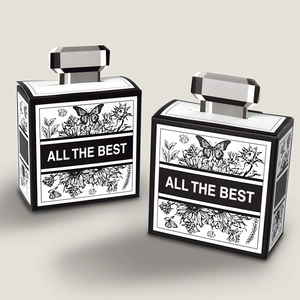 Perfume bottle shaped gift boxes with black and white floral prints and handles